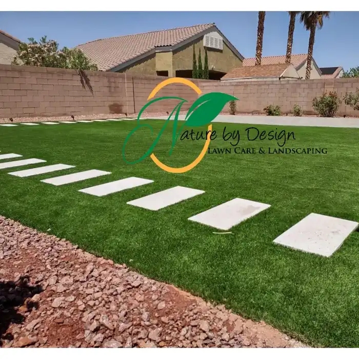 Artificial turf lawn with stone pavers and backyard walkway