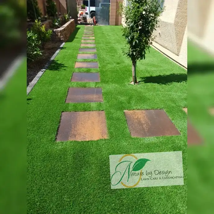 Side yard walkway with turf and rustic paver stepping stones