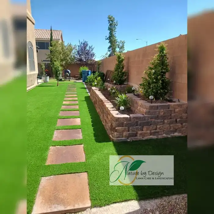Backyard stone path with raised planter and shrubs